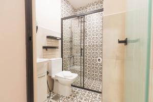 a bathroom with a toilet and a shower at Mihail Residence - Old Town of Kavala in Kavála +63 photos