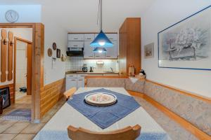 a kitchen with a table with a plate on it at Fewo Barth in Bad Hindelang