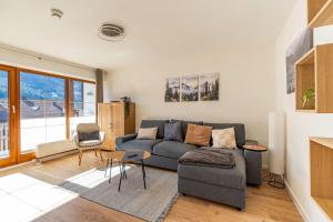 a living room with a couch and a table at Bergluft in Bad Hindelang