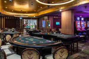 a casino with poker tables and poker machines at Grand Hotel & Casino in Port Vila