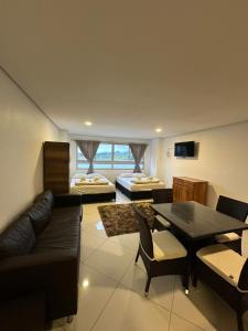 a living room with a couch and a table at Hotel Bahia Guatape in Guatapé +38 photos