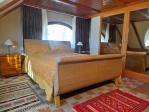 a bedroom with a bed and a large mirror at Keith Lakewood Villa in Balatonfüred +15 photos