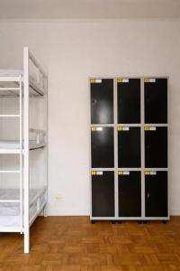 two lockers with their doors open in a room at Refugio Madalena Hostel in São Paulo