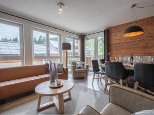 a living room with a couch and a table at Emma Top 1 XL in Dienten am Hochkönig