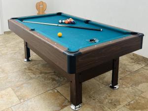 a pool table with a ball on top of it at Grieswirt L in Itter