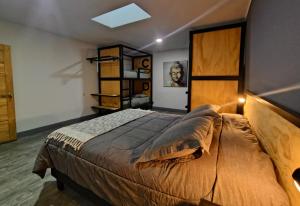 a bedroom with a large bed with a wooden headboard at Ruta Elqui in Pisco Elqui +99 photos