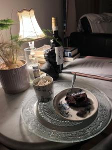 a plate with a piece of cake on a table at Homestay Snæfellsnes in Stykkishólmur