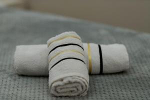a roll of toilet paper sitting on the floor at koman_lakeview_apartments in Shkodër +57 photos