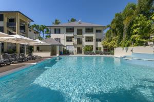 a large swimming pool in front of a building at Central Plaza Port Douglas in Port Douglas