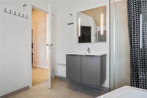 a white bathroom with a sink and a mirror at 30434-Odder-Strandvaenget-10 in Odder +43 photos