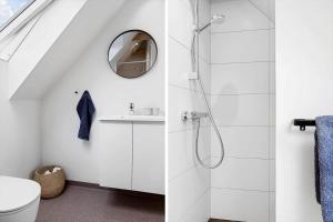 a bathroom with a shower and a toilet at 30467-Odder-Ravnsager-15 in Odder +37 photos