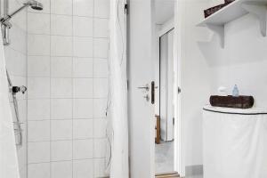 a white bathroom with a shower and a sink at 30320-Odder-Violvej-15 in Odder +22 photos