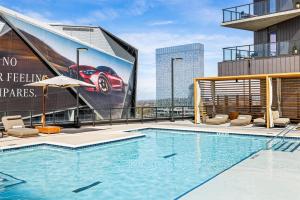a swimming pool on top of a building with a billboard at Hotel Phoenix Atlanta in Atlanta
