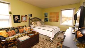 a living room with a bed and a couch at 3 Bedroomgorgeous Sunset Views!! in West Cape May