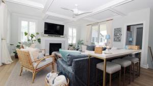 a living room with a couch and a table at Seashell Sanctuary in Cape May