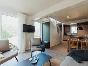 a living room with a couch and a table at Urlaub genießen in Sagard auf Rügen in Sagard +32 photos