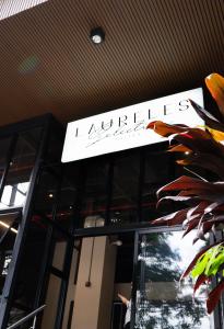 a sign on the top of a building at Laureles Selection Suites in Medellín +25 photos