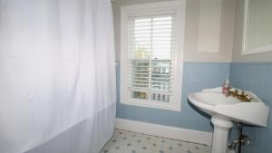 a bathroom with a sink and a window at The Bayberry House in Cape May +27 photos