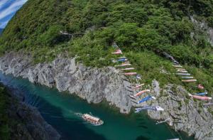 a group of boats parked on the side of a mountain at hostel大黒屋 in Miyoshi