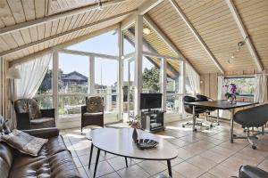a living room with a couch and a table at SL117-Slagelse-Egebaekvej-6 in Slagelse