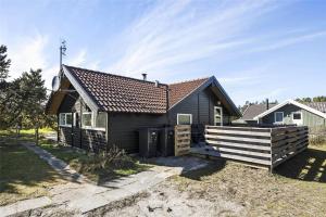 a small house with a fence in front of it at SL117-Slagelse-Egebaekvej-6 in Slagelse +18 photos