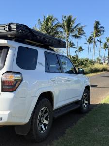 a white truck parked on the side of a road with palm trees at Island Adventure Rooftop Camper fully equipped 4Runner in Anahola +2 photos