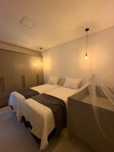 a bedroom with two beds in a room at Green House in Juazeiro do Norte