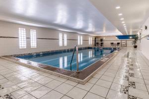 a large swimming pool in a large building at Inn on Prince Hotel & Conference Centre, an Ascend Collection Hotel in Truro