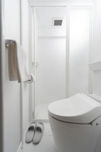 a white bathroom with a toilet and a shower at アンドステイ屋形町306 in Kyoto +37 photos