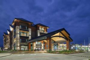 a large building with a building at Choctaw Landing Casino & Resort, Trademark Coll by Wyndham in Broken Bow
