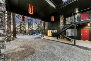 a large building with a red door and a staircase at Ambassador Lake Tahoe in South Lake Tahoe +17 photos