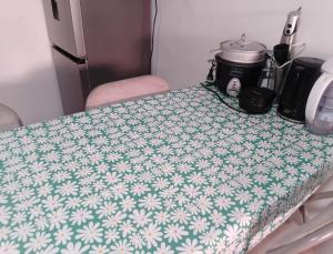 a table with a green and white table cloth on it at La Nave Coquimbo in Coquimbo