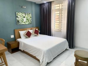 a bedroom with a large bed in a room at 60 Inn Saigon in Ho Chi Minh City