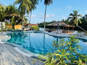 a pool at the resort at villa zoum in Assinie +8 photos