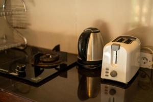 a toaster sitting on top of a counter at Akamana Villa Ubud in Ubud