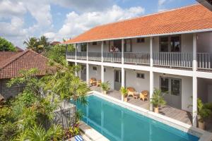 an aerial view of the hotel and the pool at The Peacock Inn in Ubud +13 photos