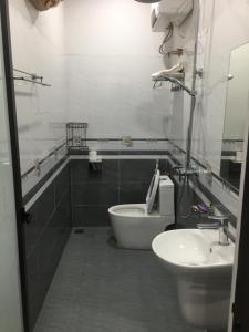 a bathroom with a toilet and a sink at Tam coc lotus lake homestay in Ninh Binh