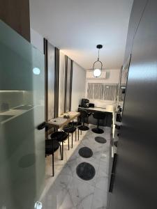 a dining room with a table and some chairs at Apartament André in Sibiu
