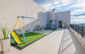 a playground on the roof of a building at Cozy Apt Pool CoWorking U116 in Fernando de la Mora