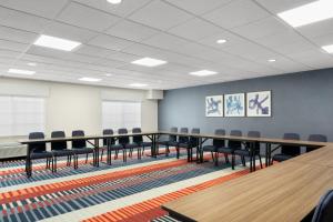 a conference room with a long table and chairs at Garner Hotel Madison - Huntsville Airport by IHG in Madison +66 photos