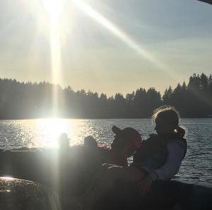 a group of people sitting on a boat on a lake at Lakeside Dune Getaway in Lakeside
