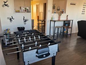 a table with a video game on it in a living room at Lakeside Dune Getaway in Lakeside