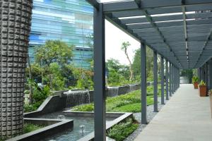 an external view of a building with a walkway at Nawana Sentul City by Alana in Bogor