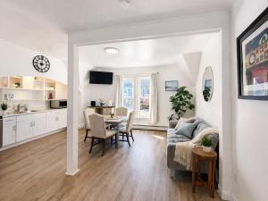 a living room with a couch and a table at Game Room Fun Extended Stay Friendly in Danielson +10 photos