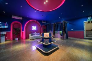 a room with purple walls and a room with a bed at Chiic House Hải Phòng in Lực Hánh +23 photos