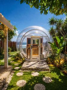 a garden with a bubble house in a yard at Bubble 4 - Romantic With Bath Uluwatu in Uluwatu
