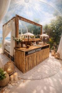 a room with a large mirror and a table at Bubble 4 - Romantic With Bath Uluwatu in Uluwatu
