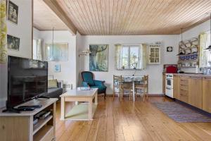 a living room with a kitchen and a dining room at SL078-Slagelse-Dybkaervej-36 in Slagelse
