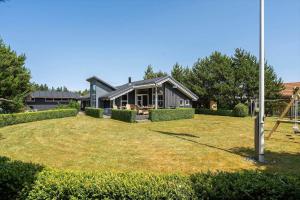a house with a large yard in front of it at 30305-Ulfborg-Bellisvej-504 in Ulfborg