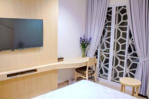 TV a/nebo společenská místnost v ubytování Mk House Scbd